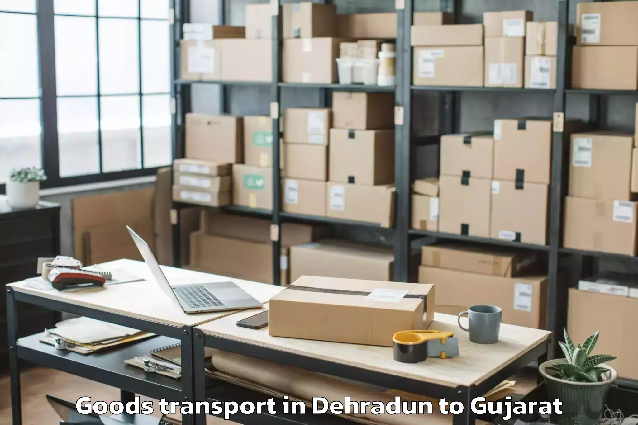 Book Your Dehradun to Keshod Airport Ixk Goods Transport Today